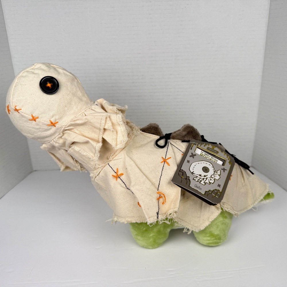 New with tags Bellzi Bronti the Scarecrow 8 inch Plush Dinosaur removable mask.